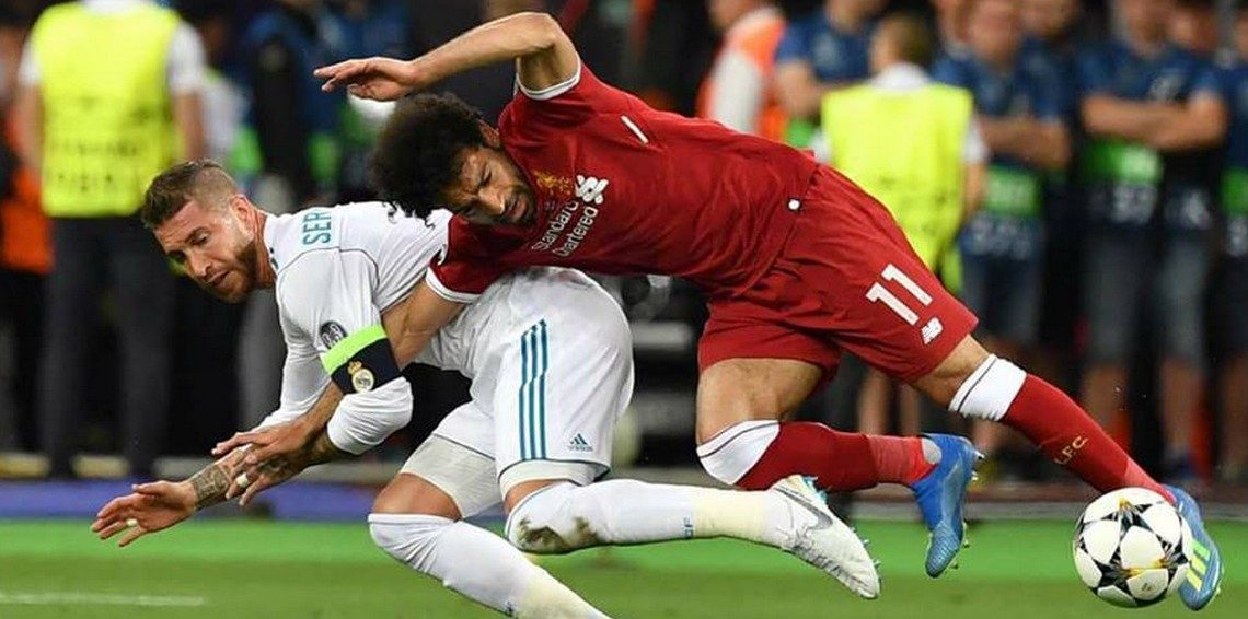 مشجعو ليفربول يطلقون حملة لمعاقبة راموس.. جماهير “الريدز” تطالب الفيفا بإيقافه بعد إيذاء صلاح