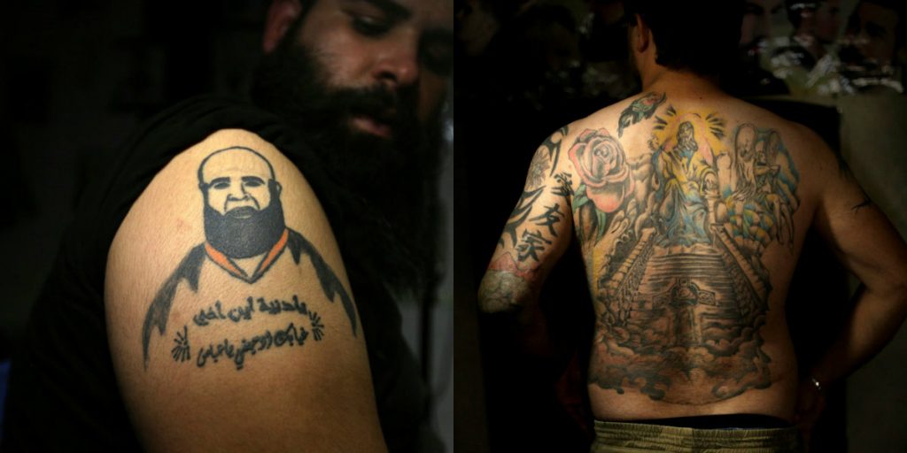 جندي عراقي يخفي تشوهاته بالوشوم