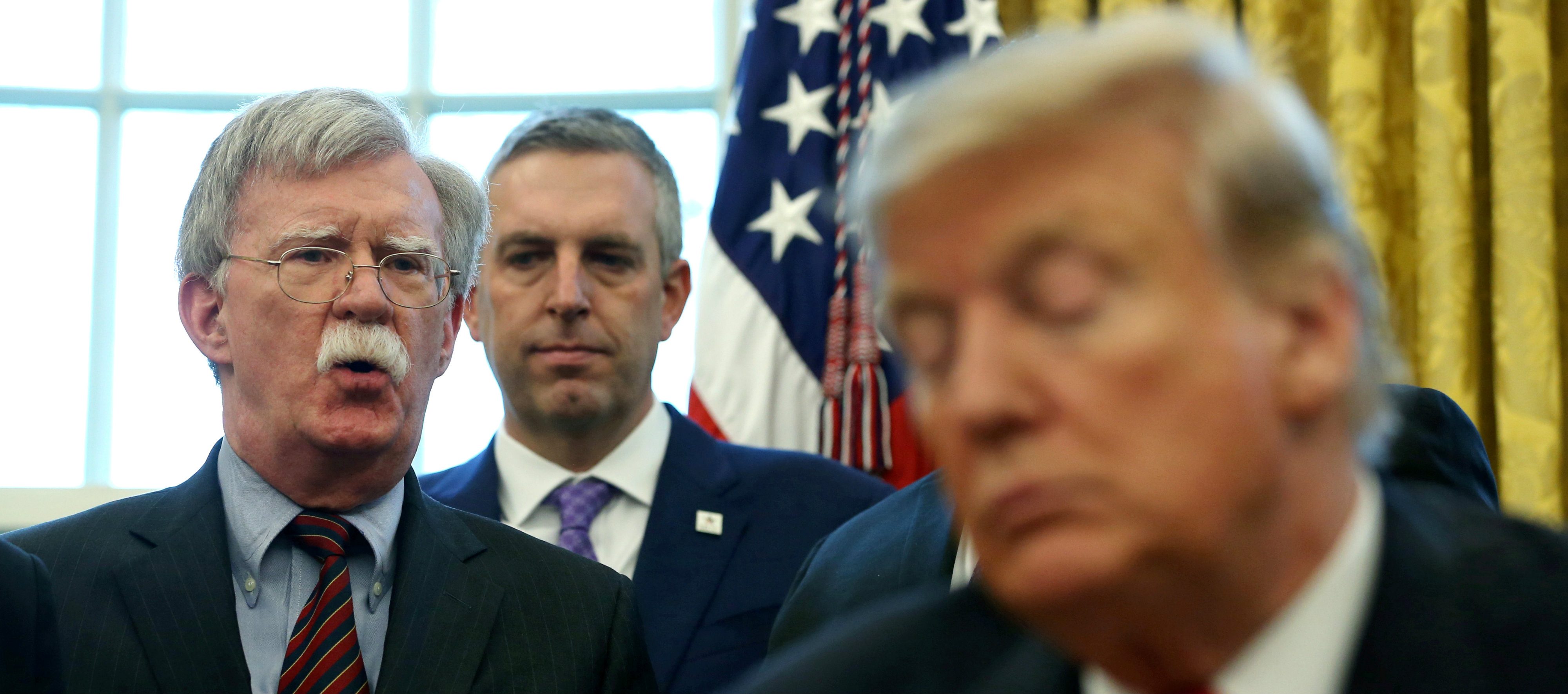 الرئيس الأمريكي دونالد ترامب وجون بولتون/رويترز