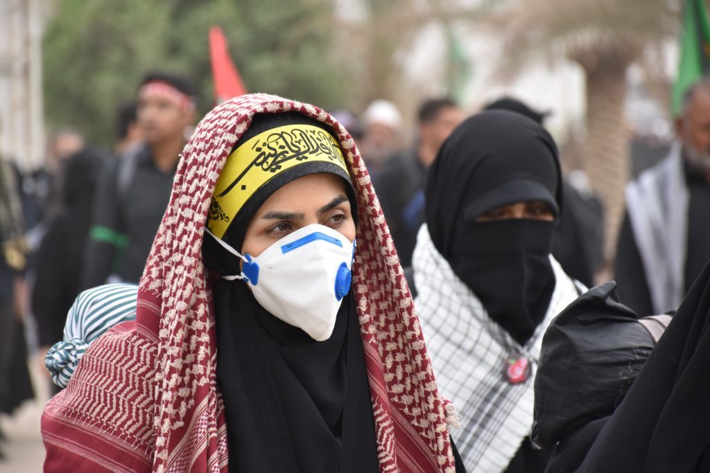 متظاهرة عراقية / mhrezaa on Unsplash