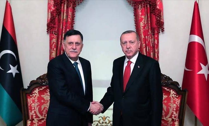 الرئيس التركي رجب طيب أردوغان ورئيس المجلس الرئاسي الليبي فايز السراج/ رويترز