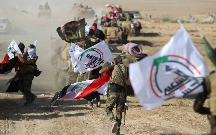 مقاتلون من الحشد الشعبي خلال معركتهم مع داعش في العراق/ Getty