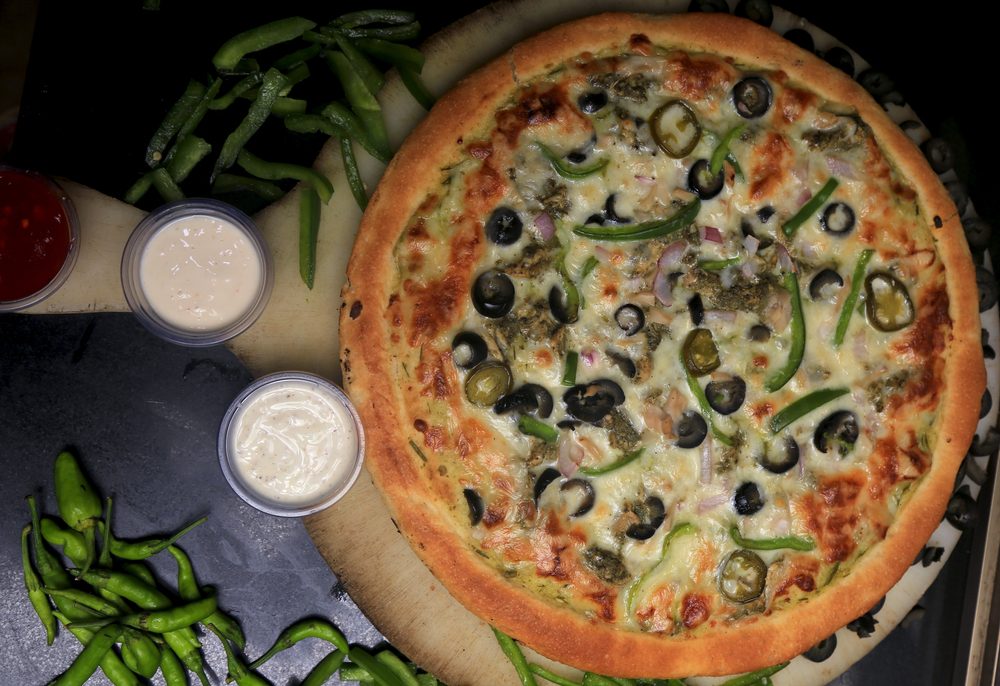 Shutter Stock/ الرانش صوص أكثر الصلصات الأمريكية المتناولة إلى جانب البيتزا