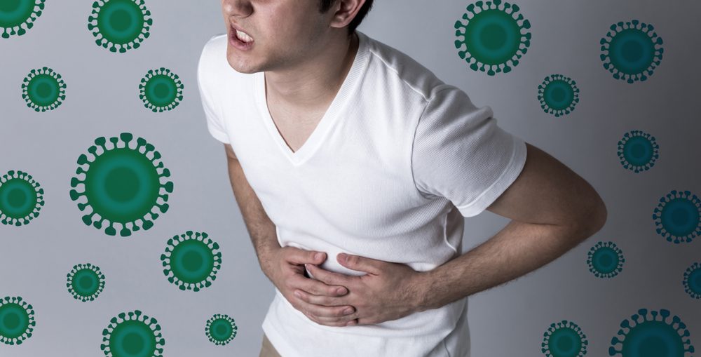 آلام المعدة من أعراض التيفوئيد المتقدمة/ Shutterstock
